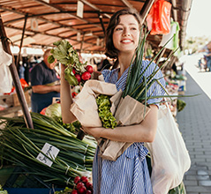 woman shopping at a farmers market