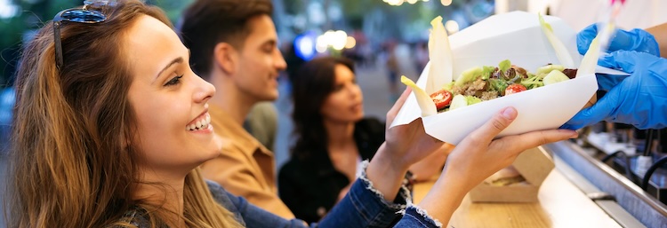 woman at food truck receiving food